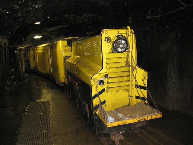 The mantrip is yellow and resembles a train.