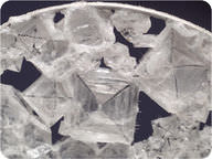 The sodium chloride forms cubes with an X shape in the middle