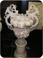 An intricately sculpted vase made of marble