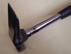 A geologist's hammer with tubular shaft and chisel head