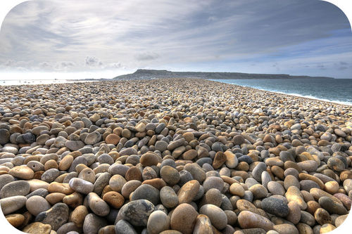 A beach covered with smooth pebbles