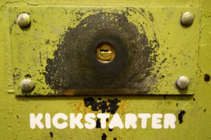 Photo of the Kickstarter Headquarters door lock: a green keyhole with the word KICKSTARTER printed in white underneath.