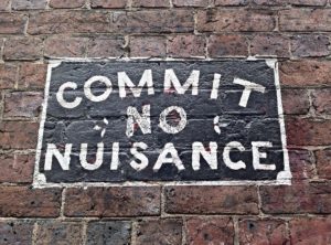 Australian sign on a brick wall that reads, 