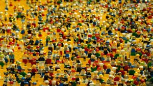 Photo of many many many brightly colored LEGO people.