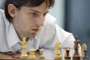 Photo of a chess master, contemplating his next move.
