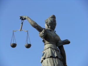 Statue of woman holding the scales of justice.