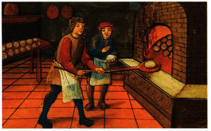 Medieval painting showing a baker with his apprentice putting bread into a brick oven.
