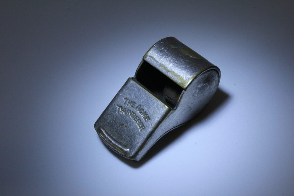 Photograph of a metal whistle