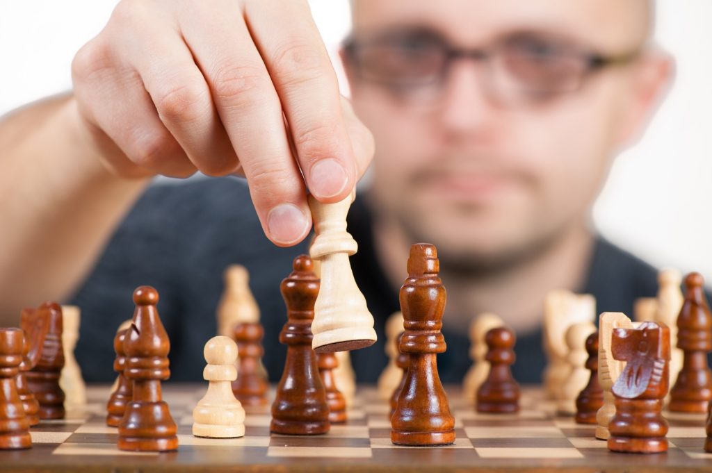 Photo of a chess master, making his next move.