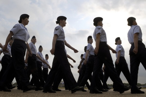 About a dozen female members of the U.S. Air Force are shown outside marching in formation.