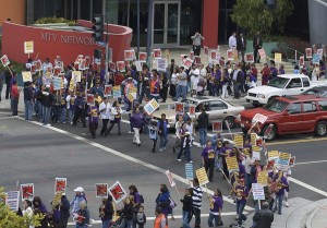 Janitors and supporters strike with signs in front of MTV network in Santa Monica.