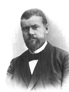 portrait of Max Weber in 1894. He's wearing a suit, has a trimmed, full-beard.