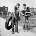 Two (approximately ten-year old boys) collecting tires in 1942.
