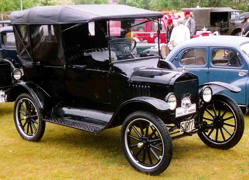 Black Model T in a car show.