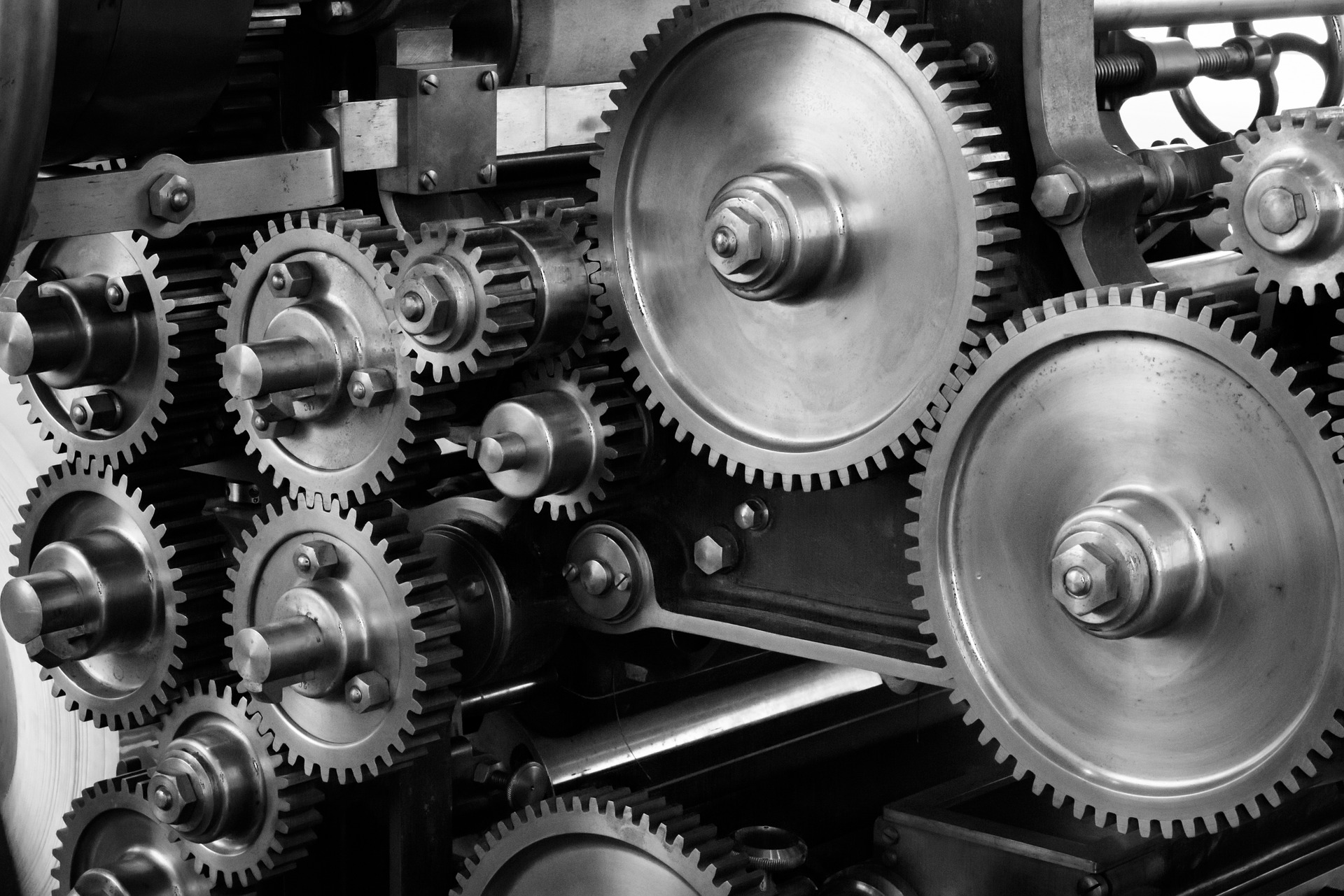 Several cogs in a machine working together in a set pattern.
