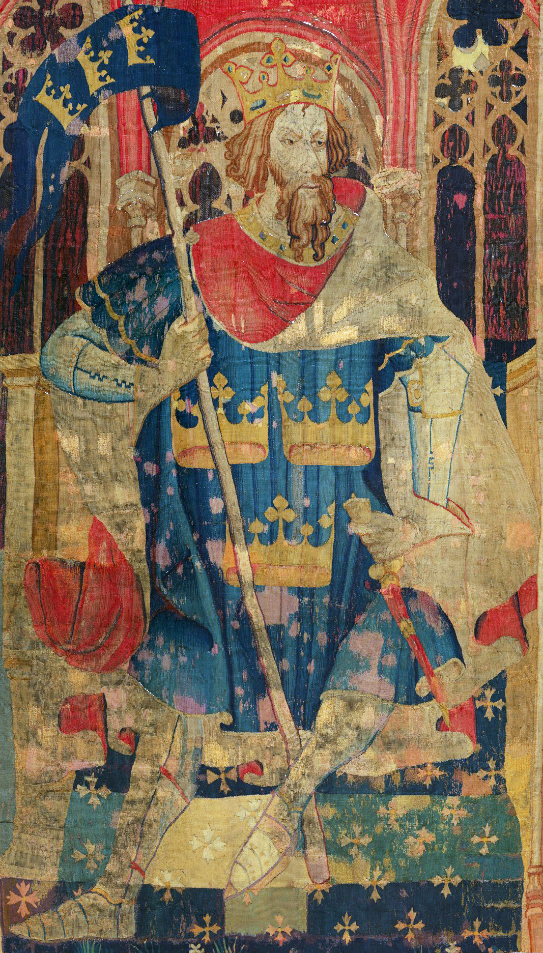 Tapestry depicting King Arthur sitting on a throne, holding a banner.