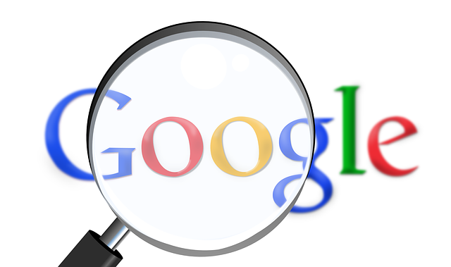 Google logo with a magnifying glass superimposed.