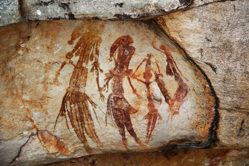 Cave drawings of people.