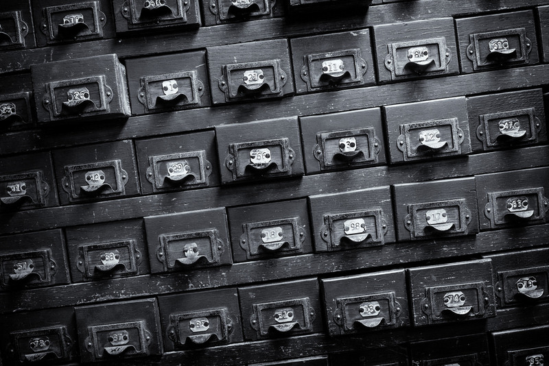 Photograph of an old card catalog filing system.