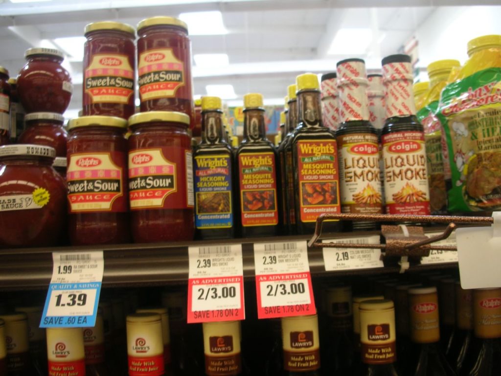 price tag placed on a shelf in front of an item