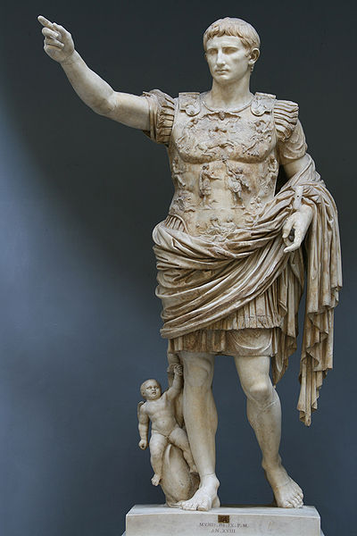 This sculpture depicts Augustus wearing armor, with his hand outstretched pointing. His other hand may have been positioned to hold something. At left side, Cupid is pulling on the hem of his clothing.