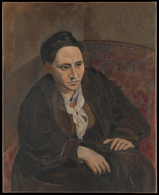 Gertrude Stein leaning forward, with her hands on her knees. She is wearing dark browns. The background of the painting is a brown with hints of a wallpaper pattern.