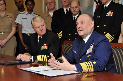 Photo: Commandant of the Coast Guard Adm. Thad W. Allen, right, delivers remarks as Chief of Naval Operations Adm. Gary Roughead looks on after the signing of the memorandum of agreement for the Safe Harbor program during a signing ceremony at the Pentagon.