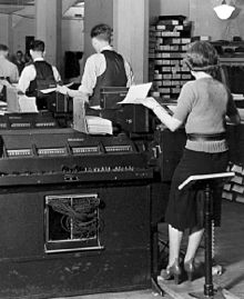 Old black and white photo of tabulating counters
